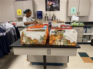 Cadet Woods assembles Thanksgiving Baskets 